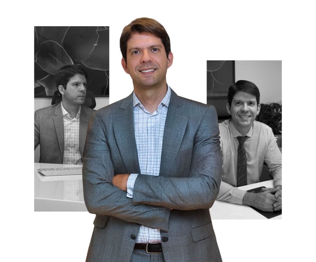 Foto do Dr. Murilo Vilela, cardiologista especializado em insuficiência cardíaca e transplante, sorrindo na fachada da Clínica Pulsarti